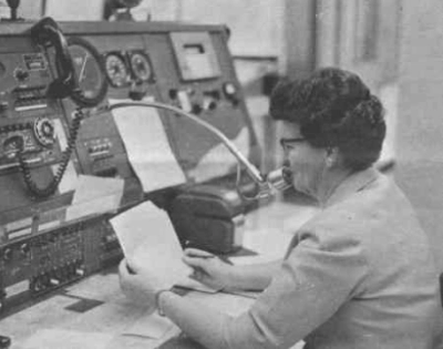 Flight Watch specialist at a Flight Service Station console in Wichita Falls, Texas